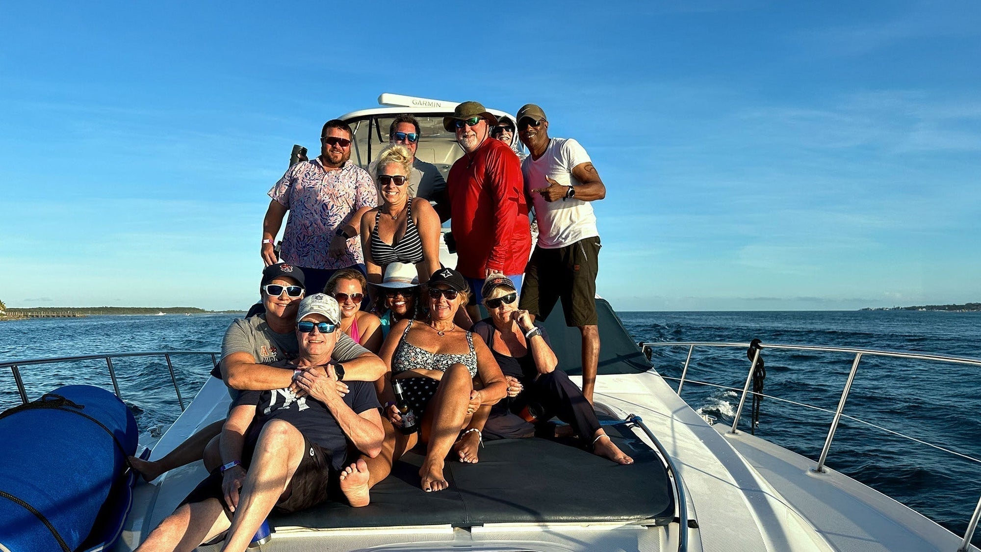 Group of Those People on the front of a yacht